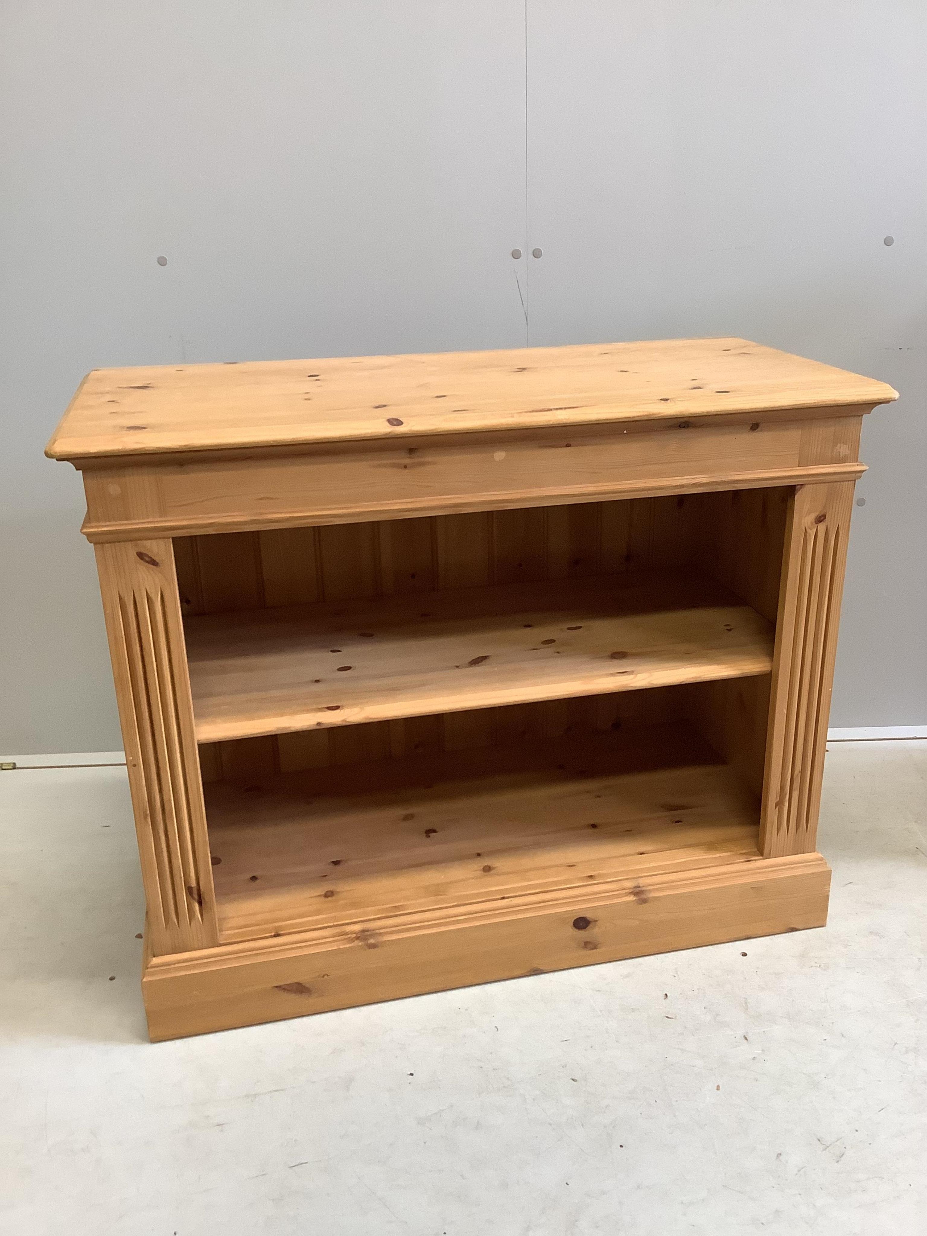 Two reproduction pine open bookcases, larger width 91cm, depth 44cm, height 92cm. Condition - fair